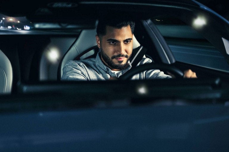 Person sitting in the driver’s seat of a parked 2024 Ford Mustang® coupe | Lombard Ford in Winsted CT